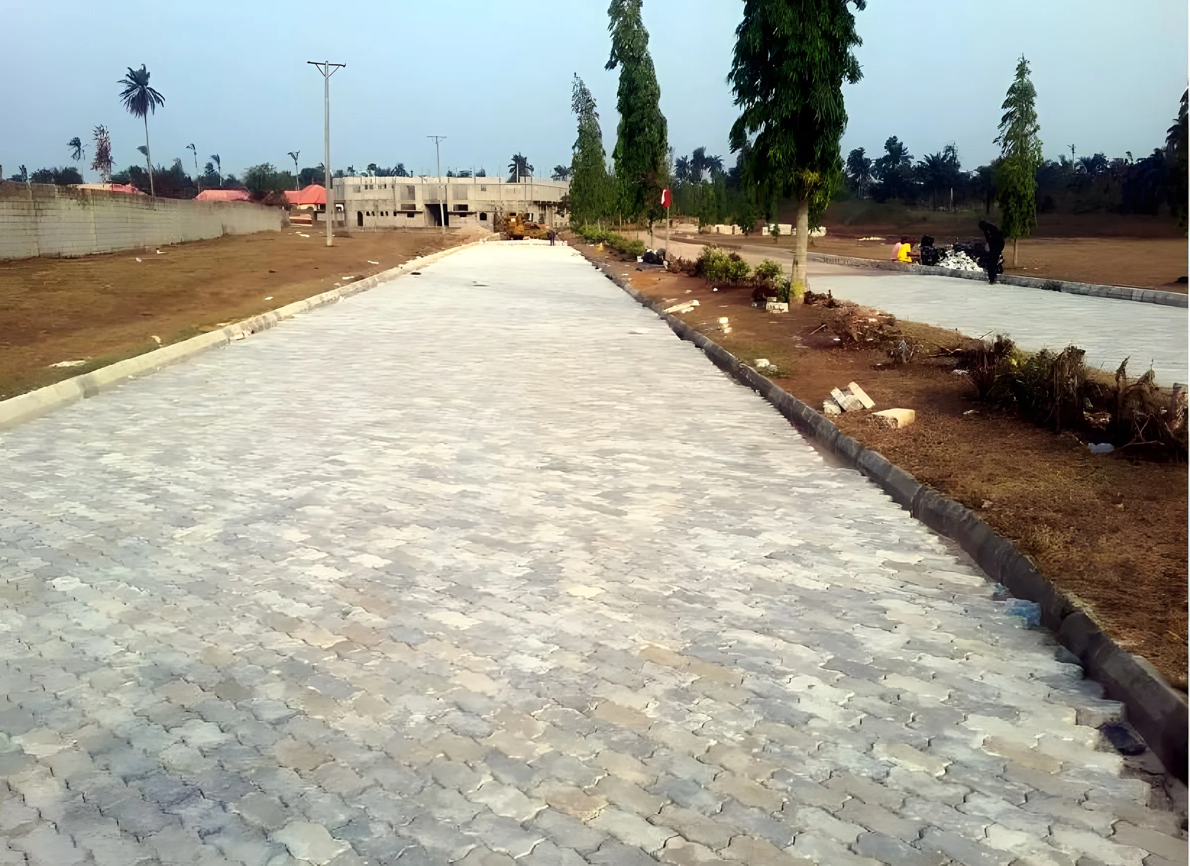 Site progress · Finished paved estate road